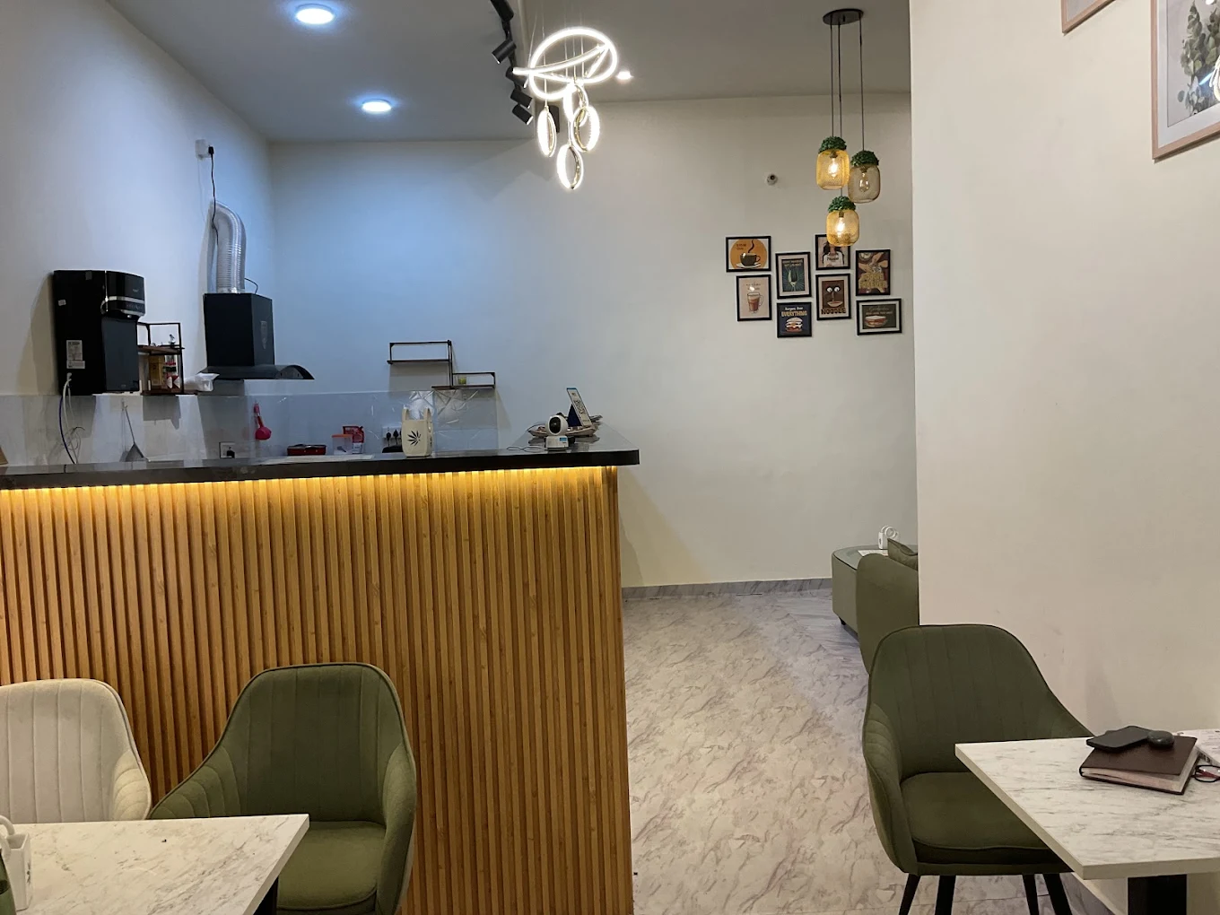 KAAFII Café Newai — wooden slatted bar counter with warm amber lighting